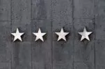 Review Stars on the Side of a Property